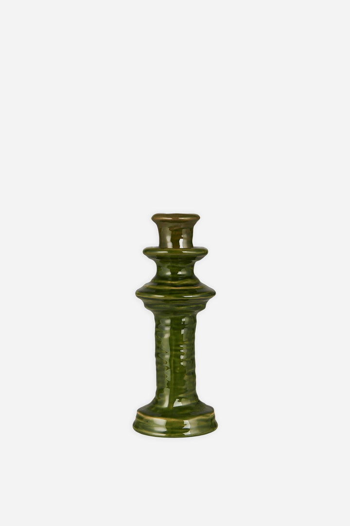 ceramic candle holder with reactive green glaze