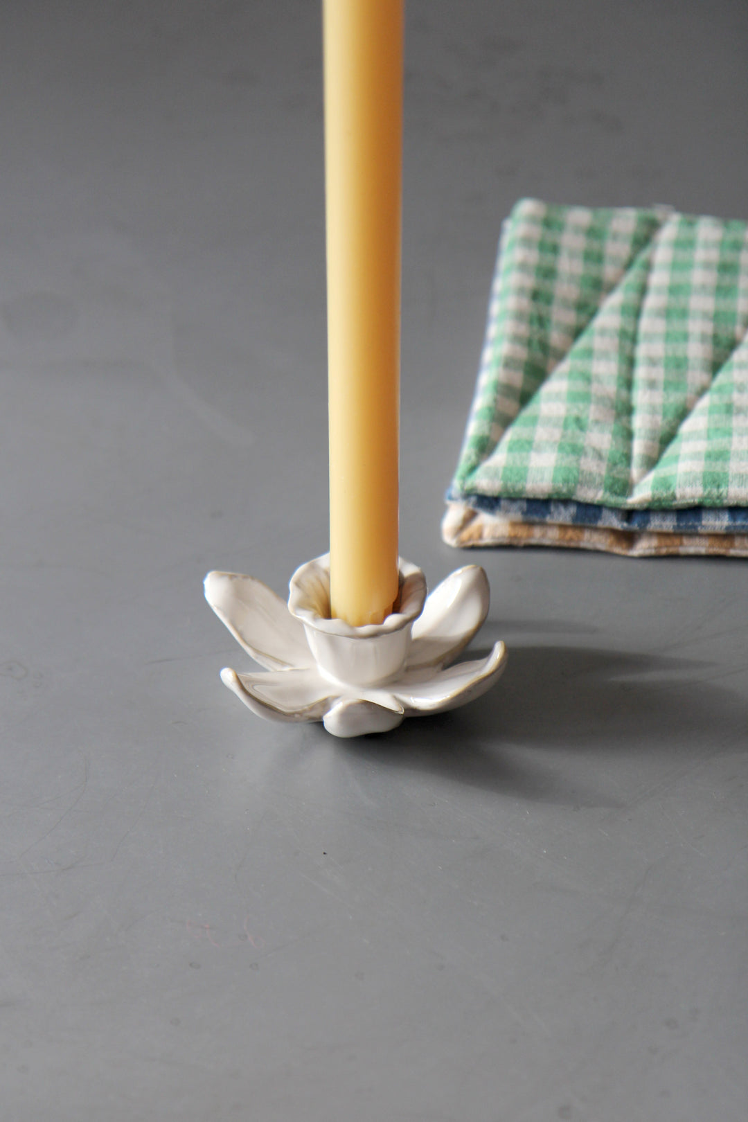 daffodil candle holder in cream with yellow dinner candle