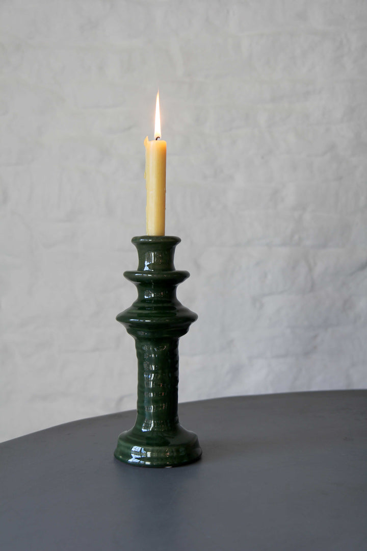 green glazed candle holder