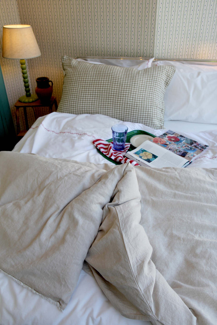 ruffled linen quilt on bed