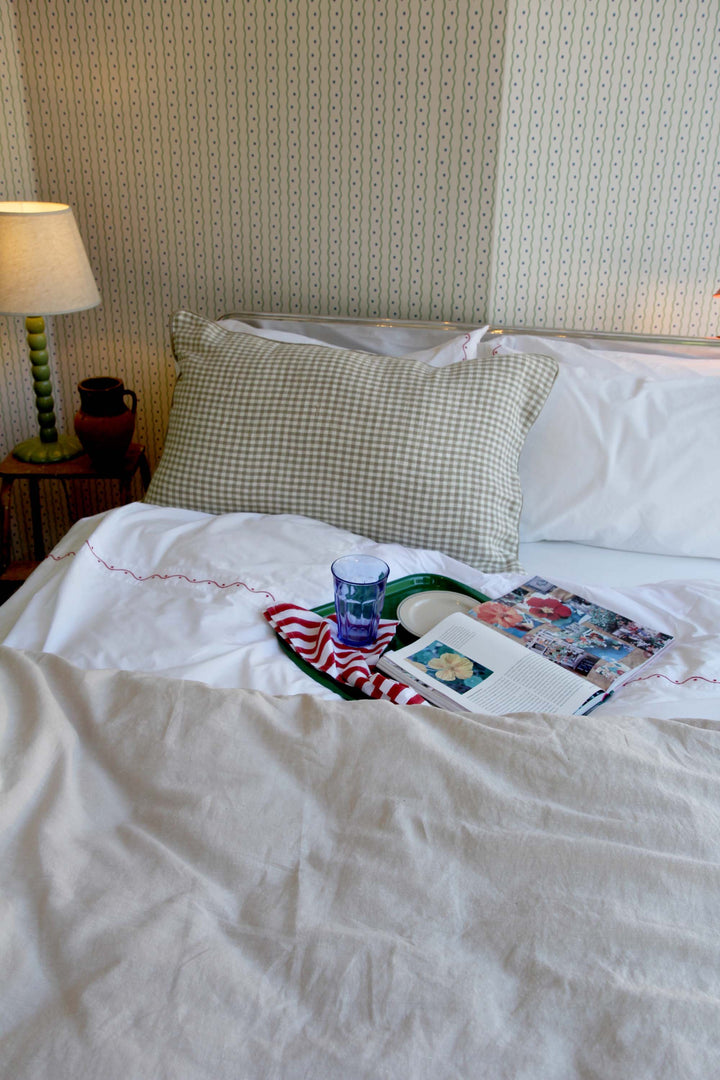 limy quilt in natural linen on bed