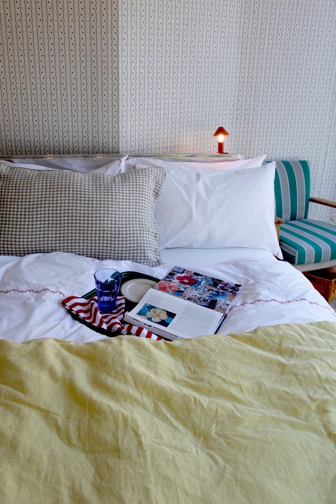 limy quilt in paille yellow linen on bed