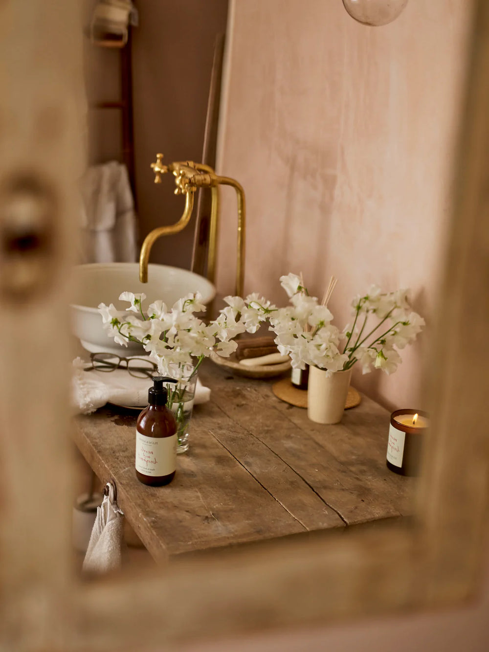 plum and ashby neroli and bergamot lotion in whimsical pink bathroom