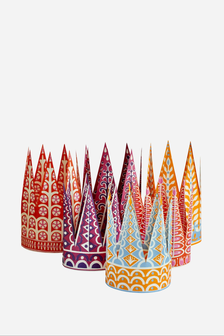 Colorful paper party hats with patterns on a white background