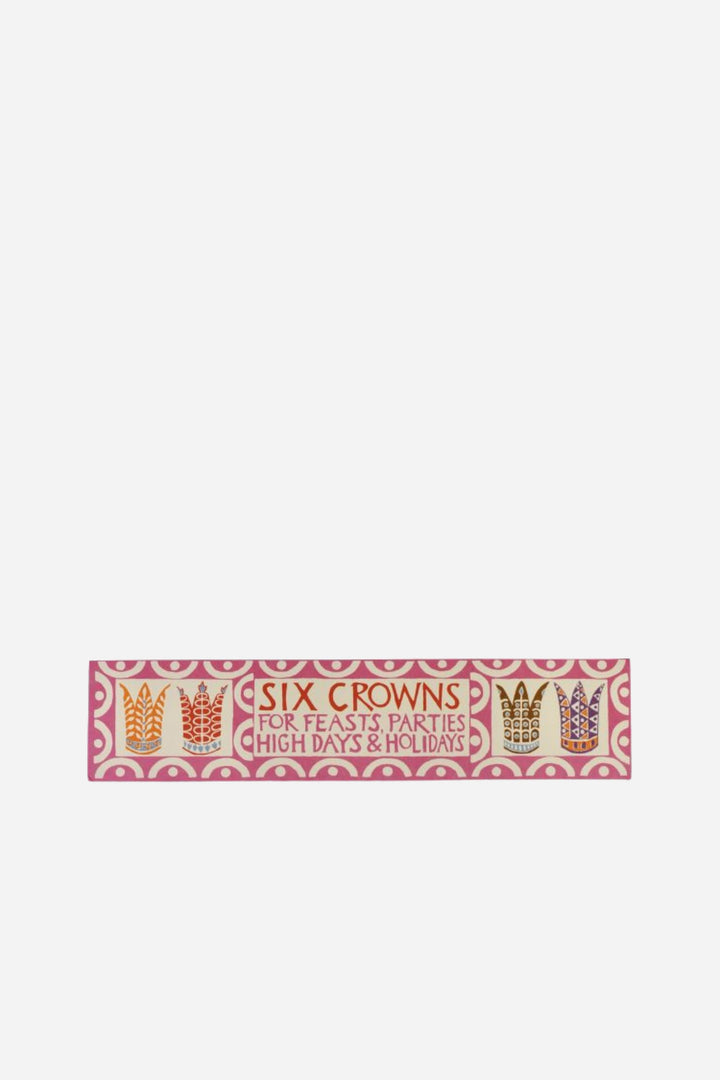 Decorative ribbon with text and crowns on a white background