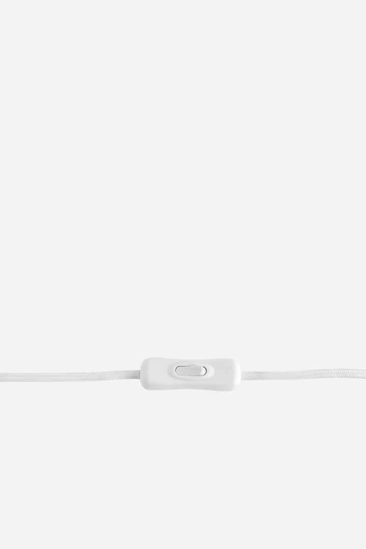 White cable with a plug on a light gray background