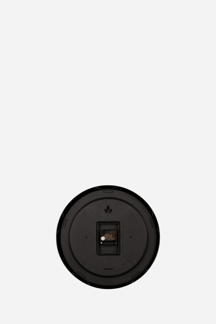 back of clock in front of white backround