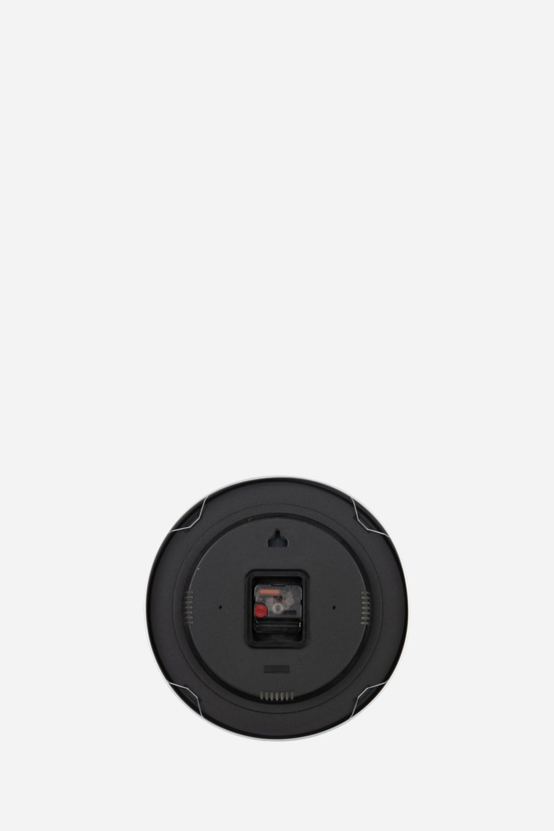 Back of clock in front of white back round