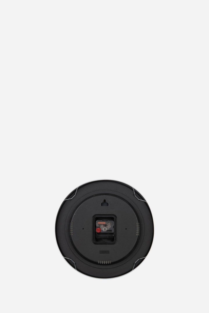 Back of clock in front of white back round