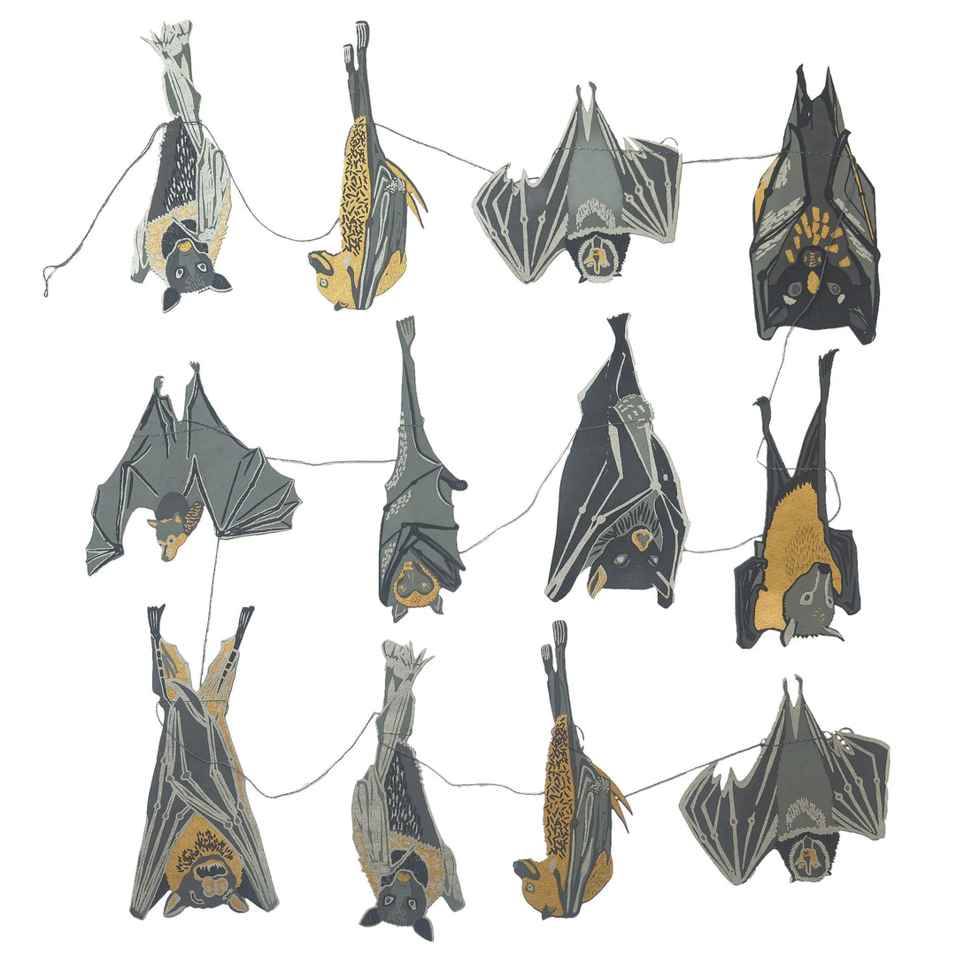 String of bat-shaped decorations on a white background