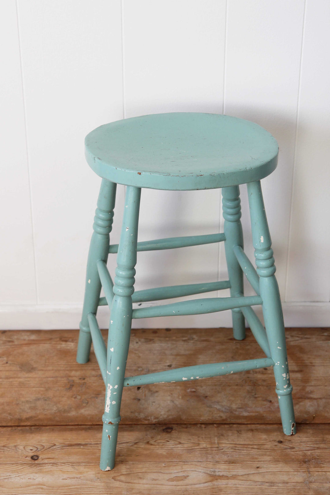 vintage wooden stool painted in pale blue