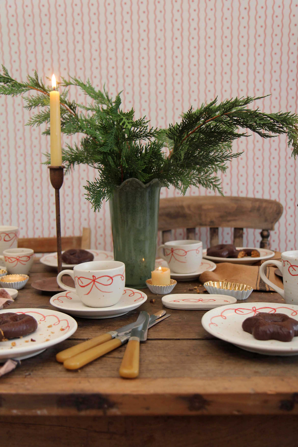 milla tall green glass vase with wavy rim on winter table