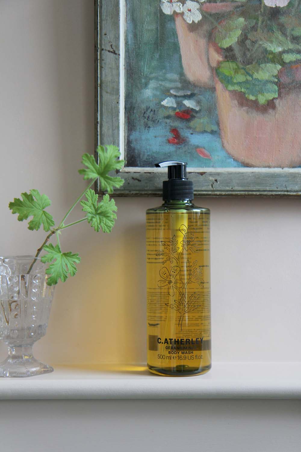 c.atherley geranium body wash in green bottle with pump in pink painted bathroom