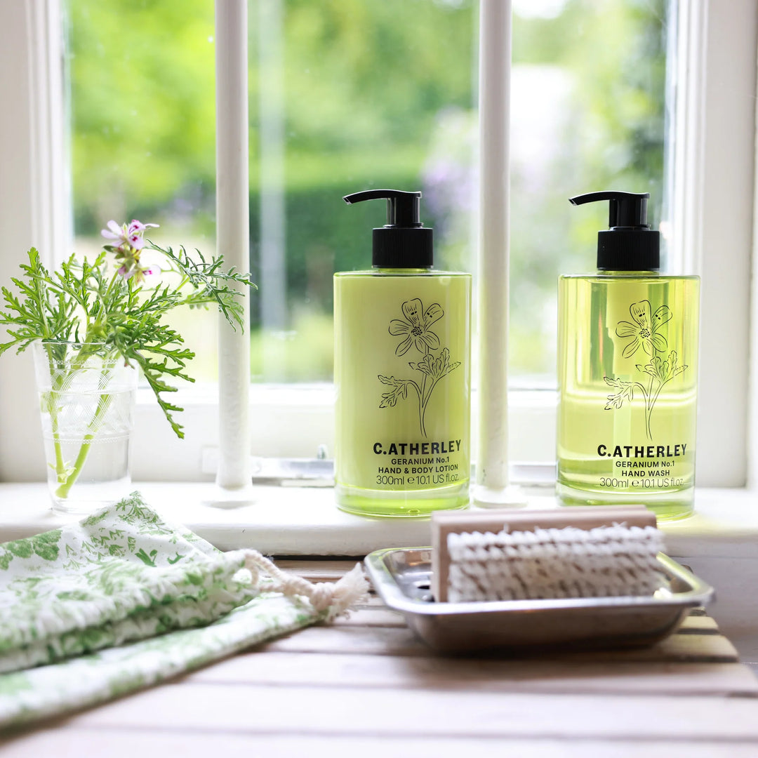 c.atherley geranium hand wash in green glass bottle on kitchen windowsill