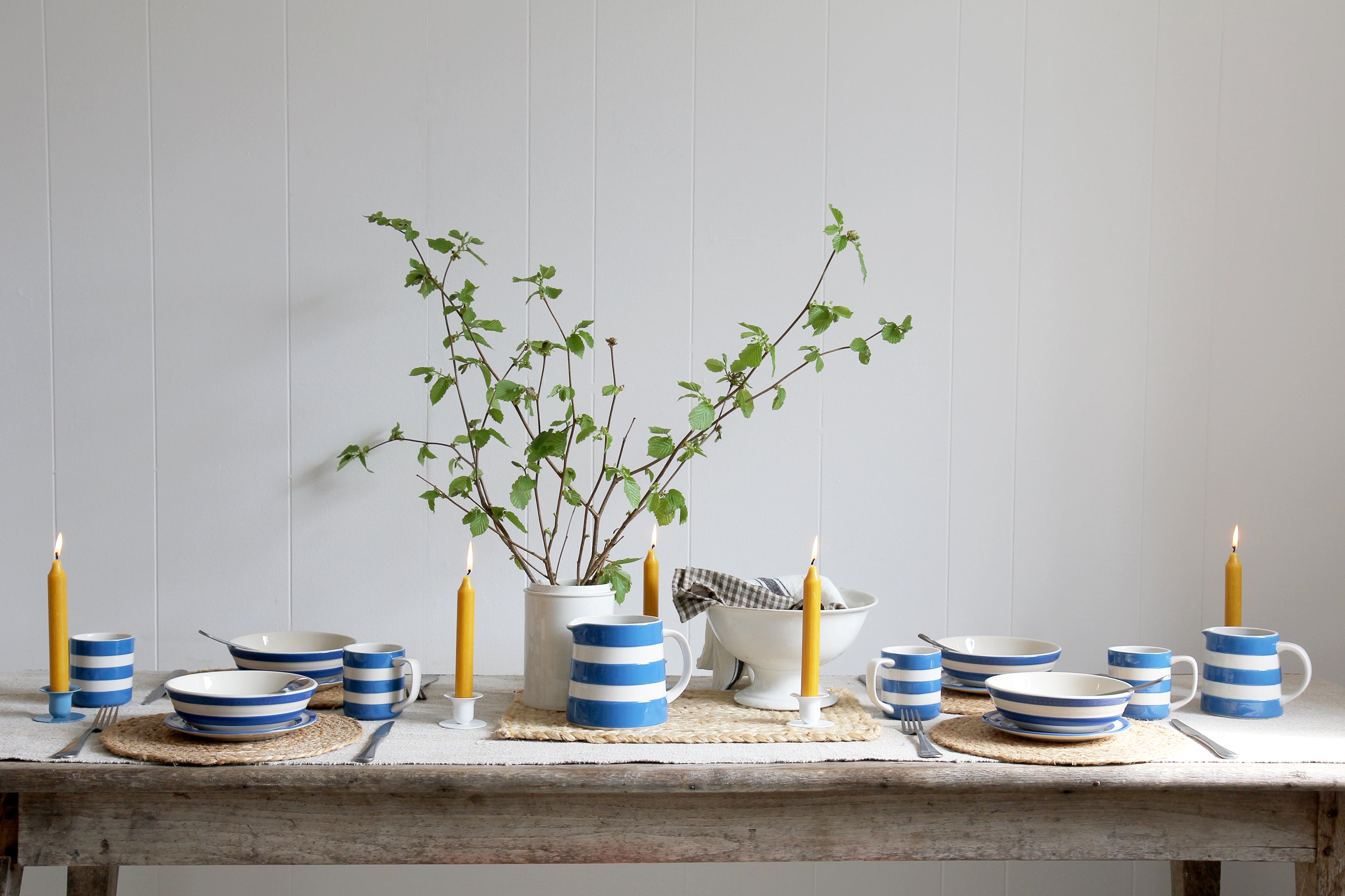 Blue and white cornishware tablescape with beeswax candles