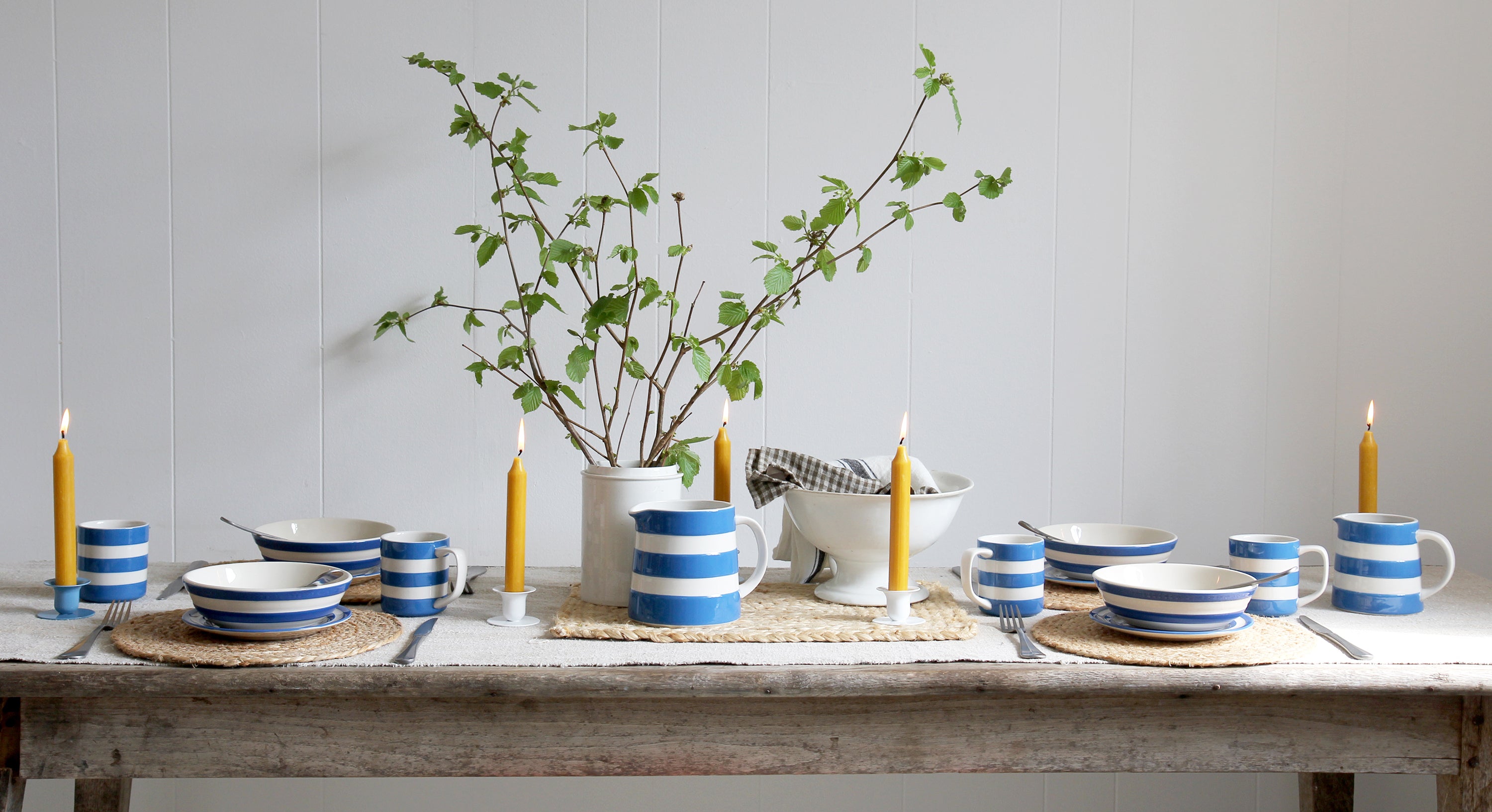 Blue and white cornishware tablescape with beeswax candles