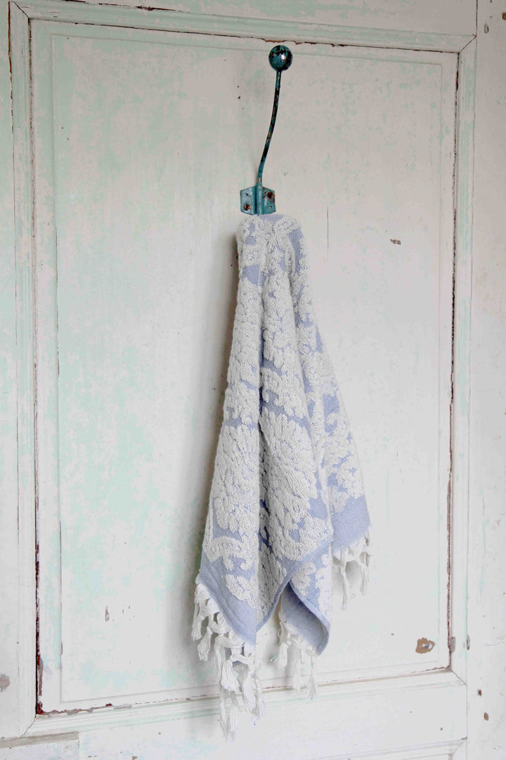 damask blue hand towel on vintage hook