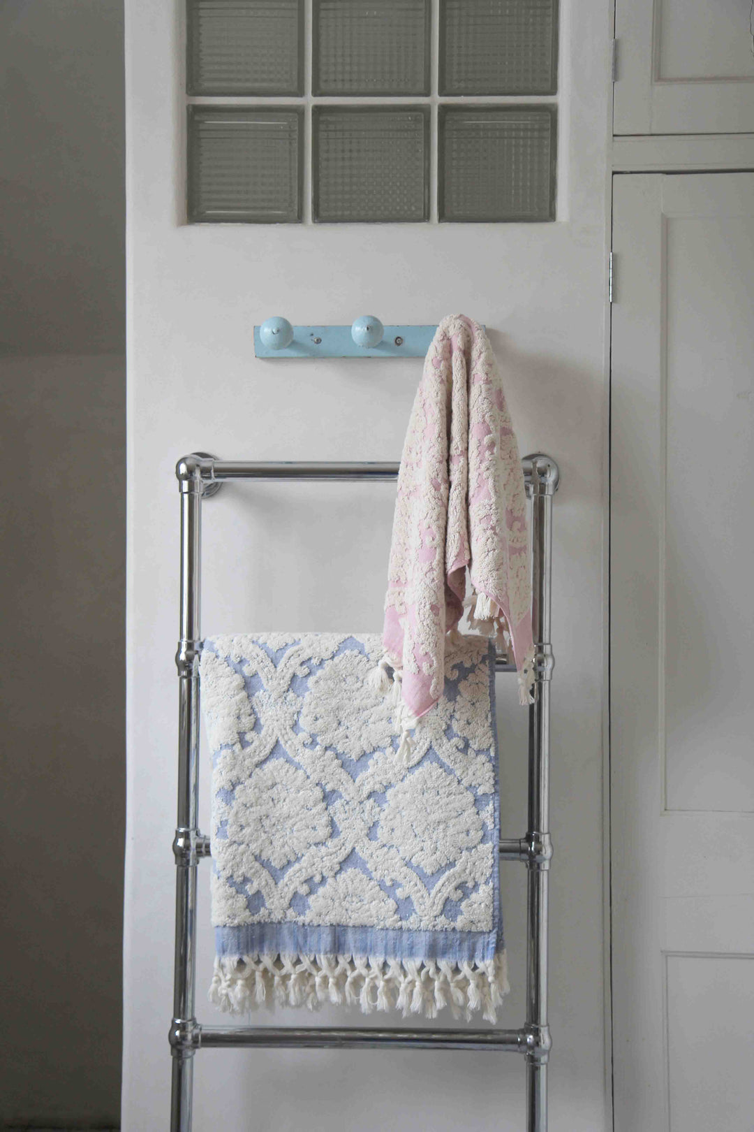 pink and cream damask hand towel in vintage bathroom