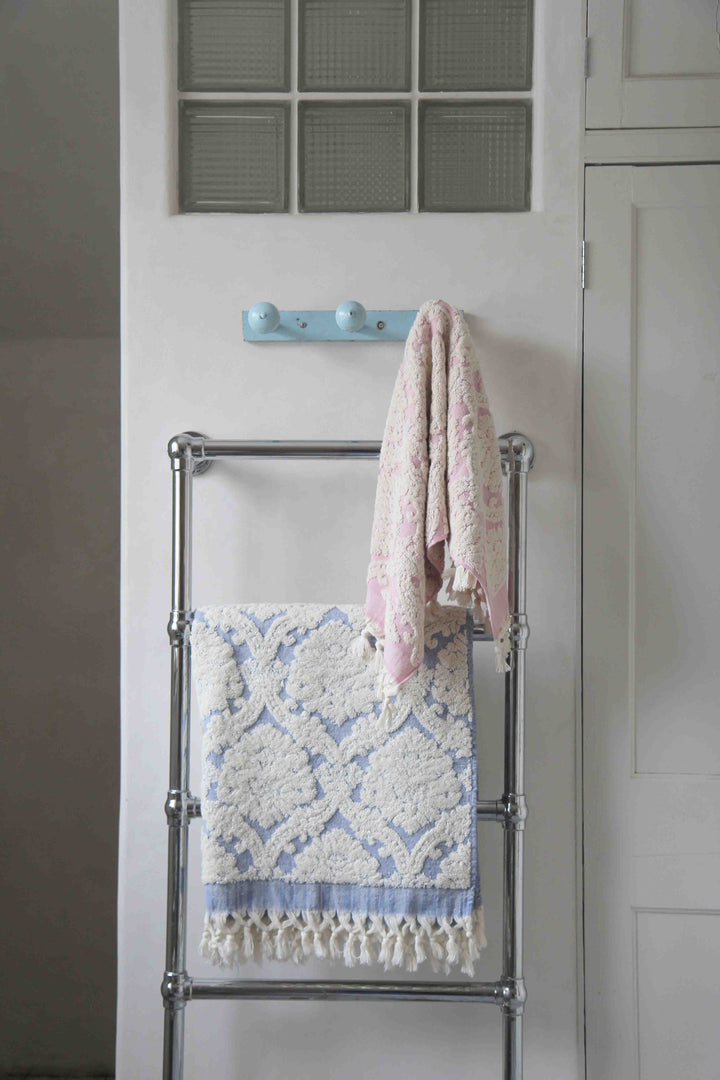 pink and cream damask hand towel in vintage bathroom