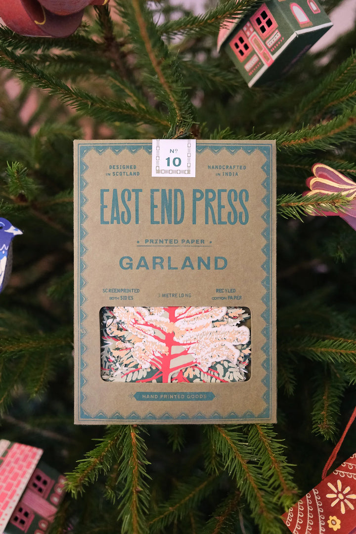 Box of East End Press Garland on a Christmas tree
