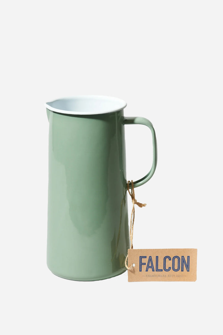 A green Falcon enamelware 3 pint jug with a handle on a white background, labelled with the brand name 'FALCON' in bold.