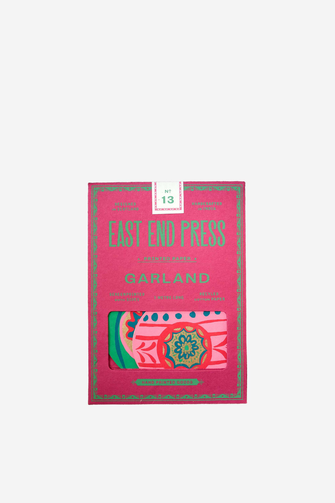 festive bauble garland by East End Press on a pink background