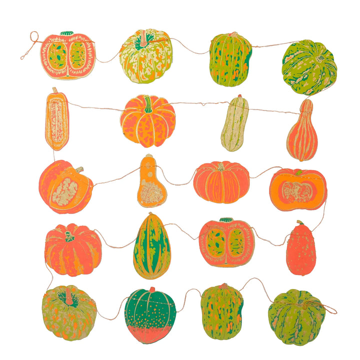 Decorative string with colorful pumpkins and gourds on a white background
