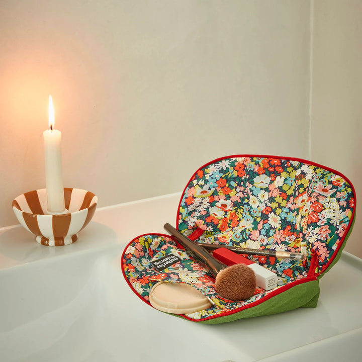 liberty print lined make up bag filled with make up