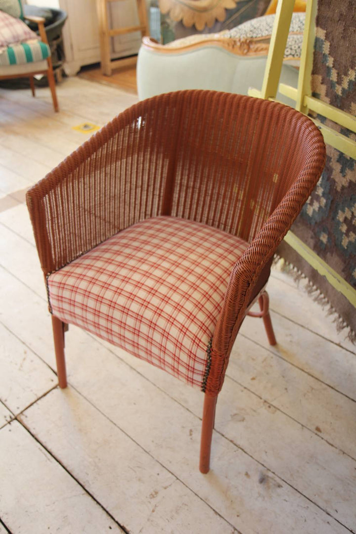 lloyd loom pink chair with red check seat