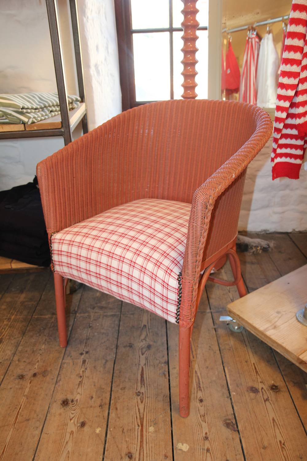 lloyd loom pink chair with red check seat