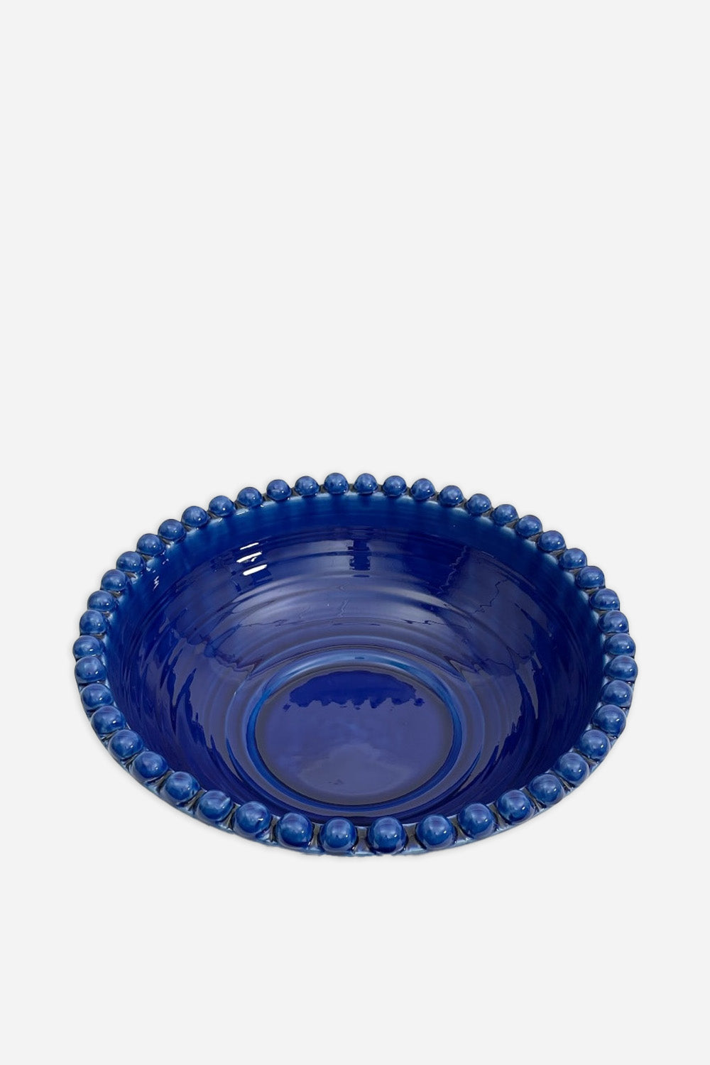cobalt blue ceramic serving dish with bobble rim