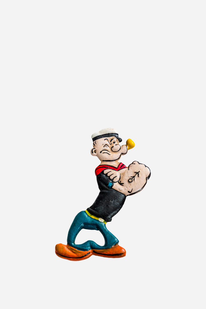 Cartoon character figurine holding a smaller figure on a white background