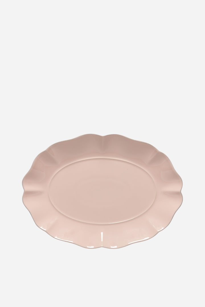 Pink ceramic plate on a white background