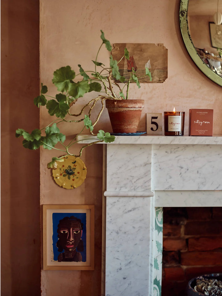Candle Sitting Room Sandalwood and Fern sat on mantlepiece in terracotta room