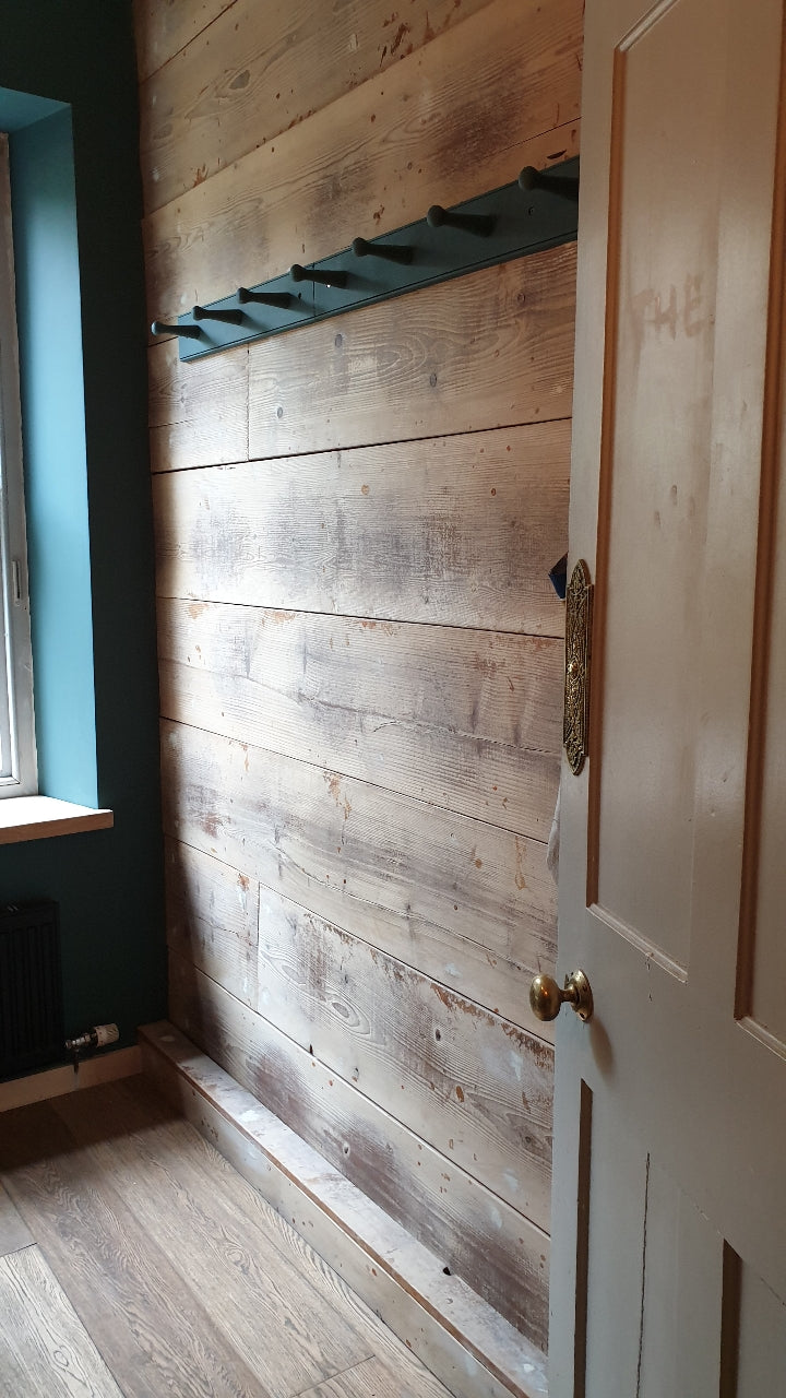 room clad in reclaimed antique pine boards