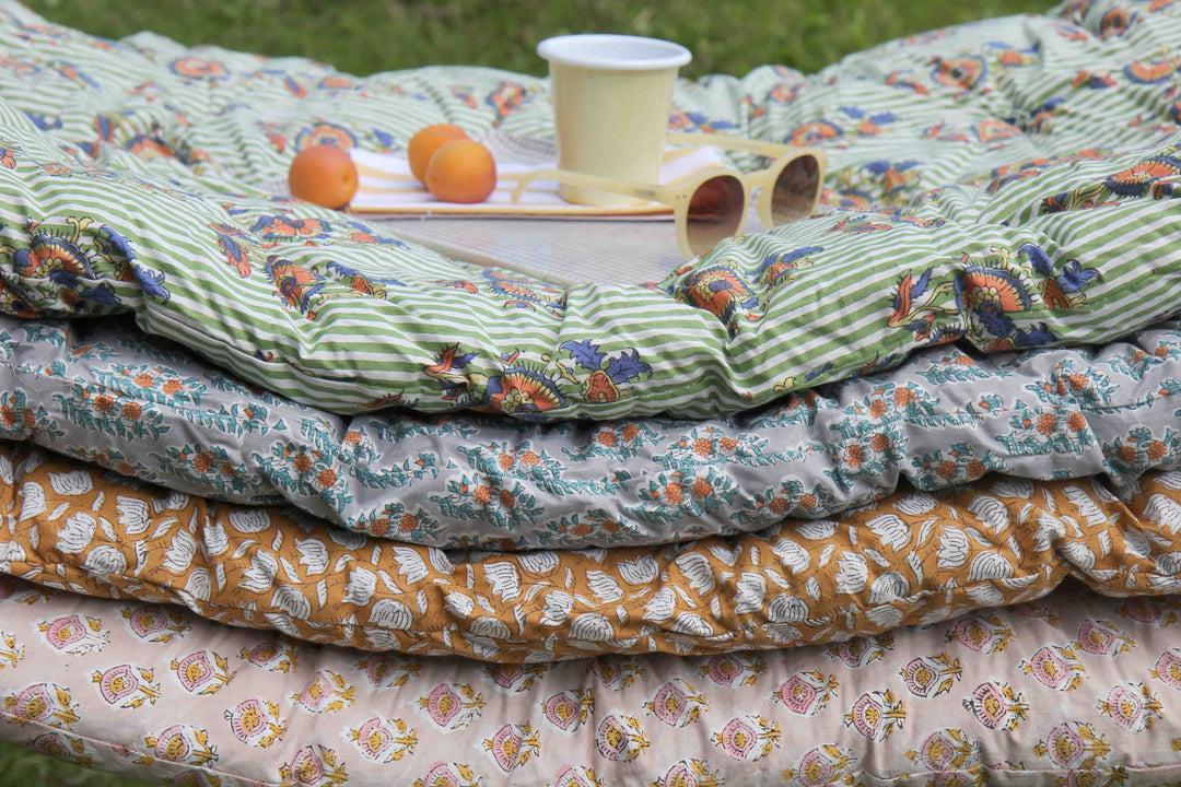 pile of colourful cotton block printed mattresses