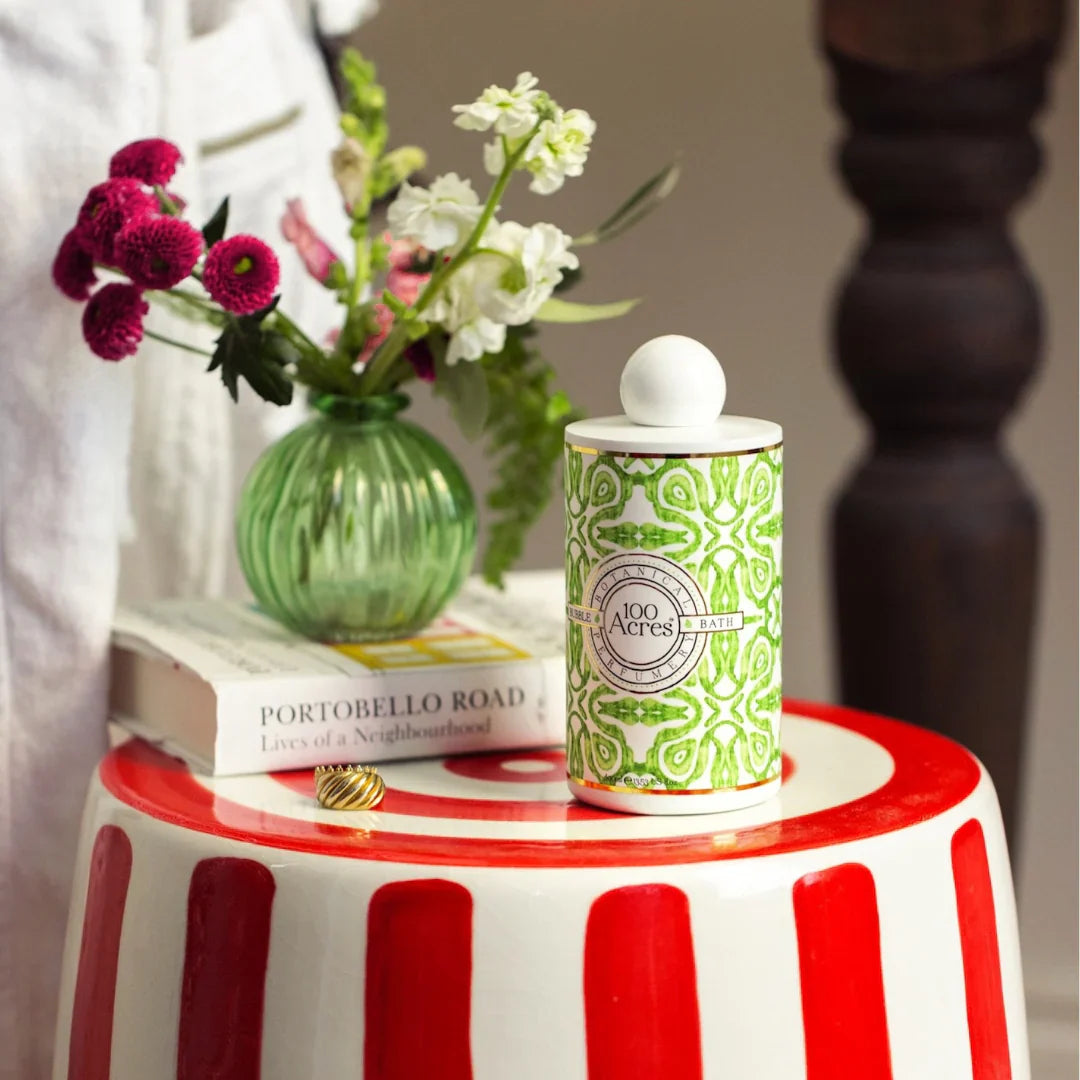 100 acres bubble bath on red and white striped side table 
