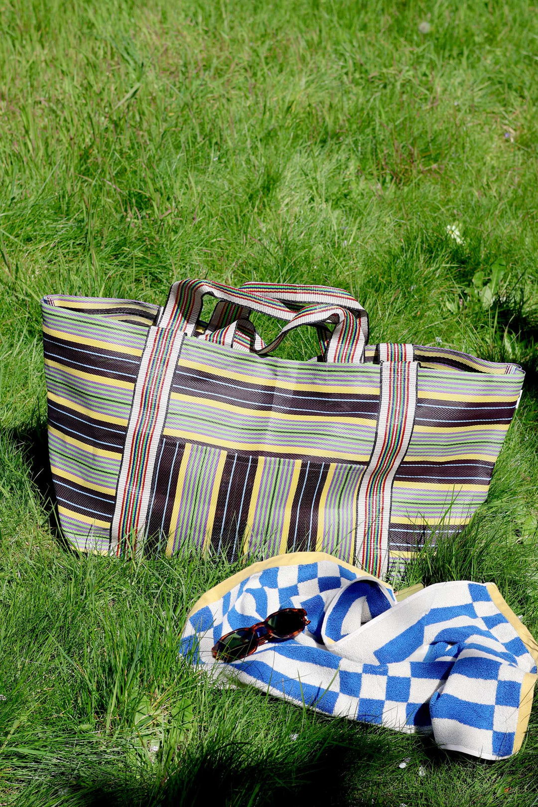stripy summer beach bag on grass with towel. Domestic Science Home bag collection