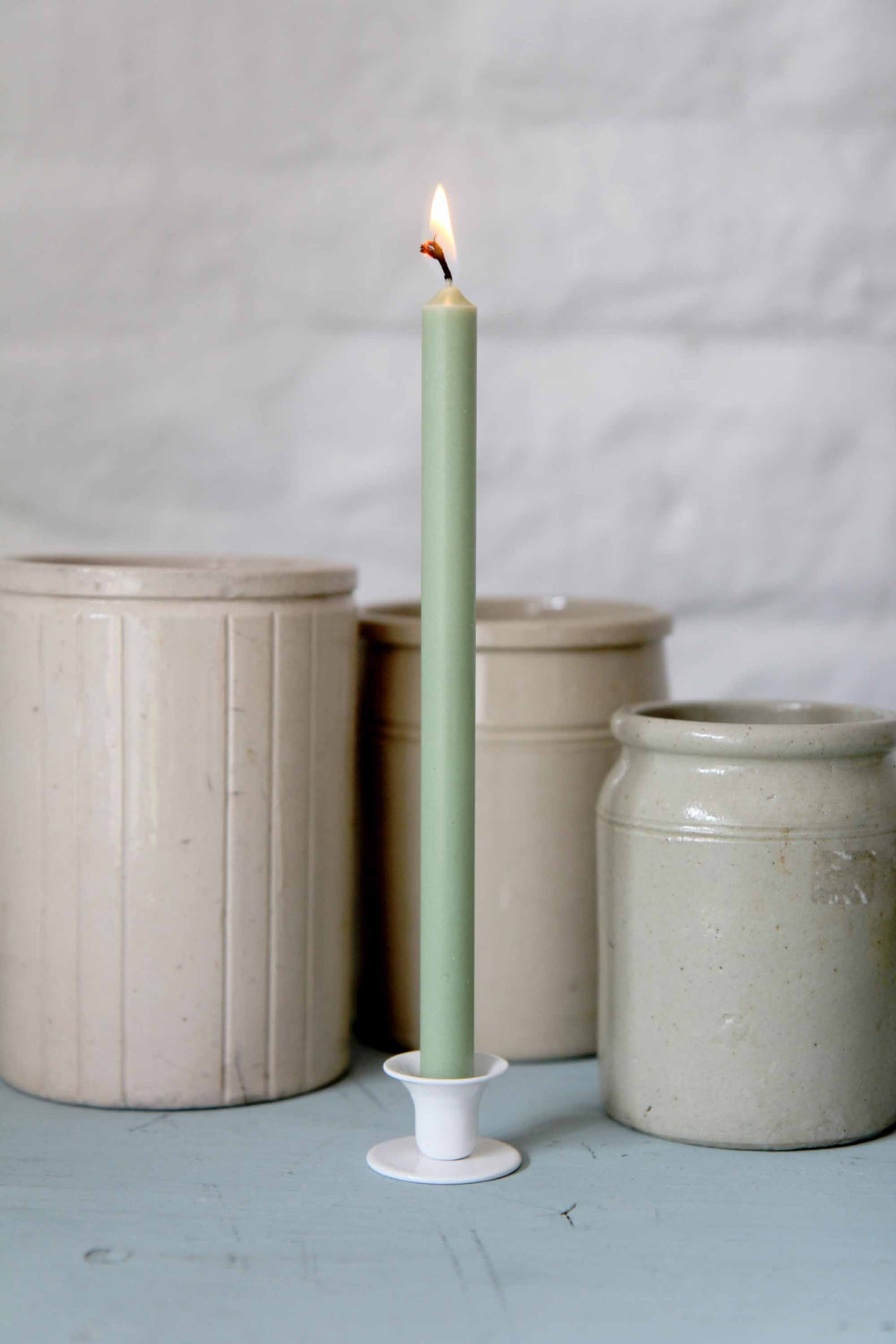 green taper candle with vintage pots from Domestic Science taper candles and candle holder collection