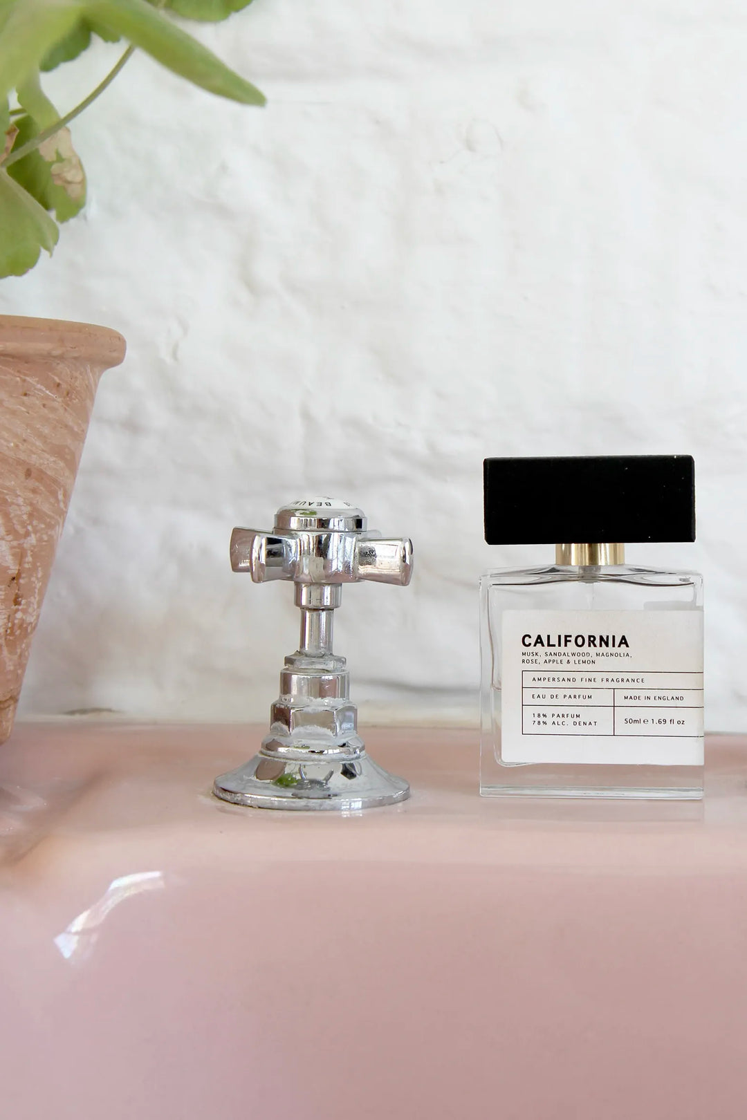 Ampersand Fragrance Collection - bottle of California perfume sat on vintage pink sink