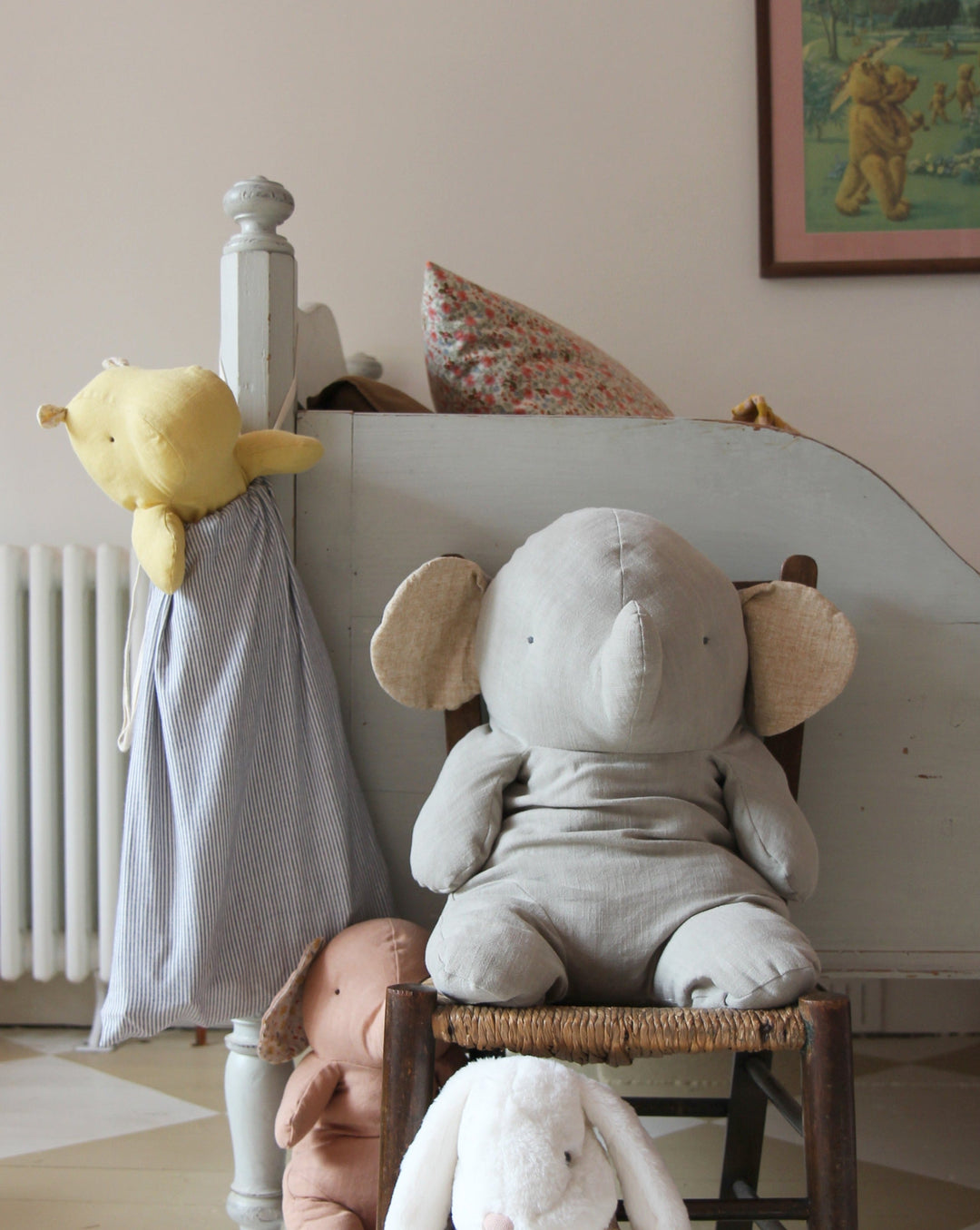 picture of childrens bedroom with selection of soft Maileg linen toy elephants and hippo