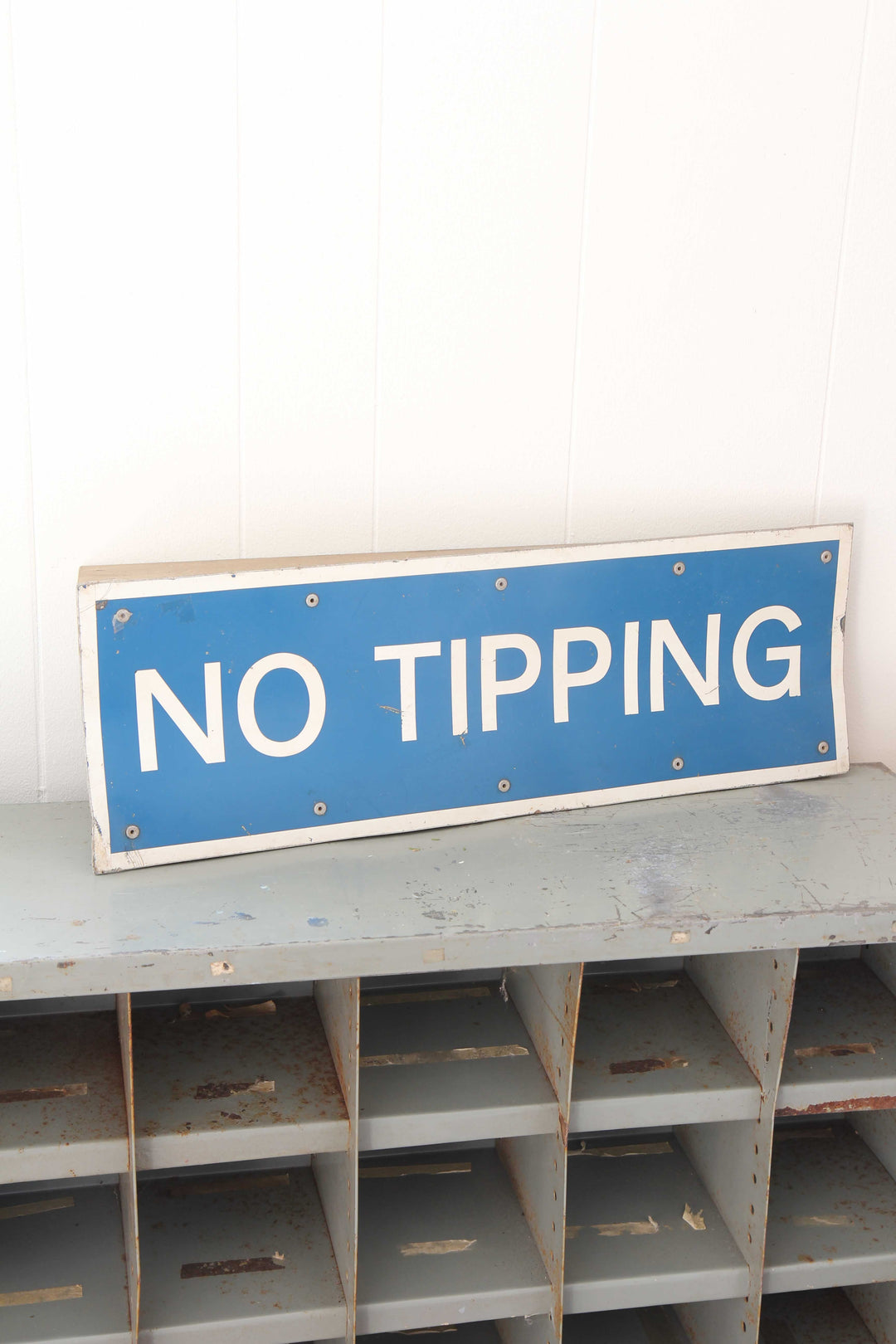 vintage industrial blue and white 'no tipping' metal sign