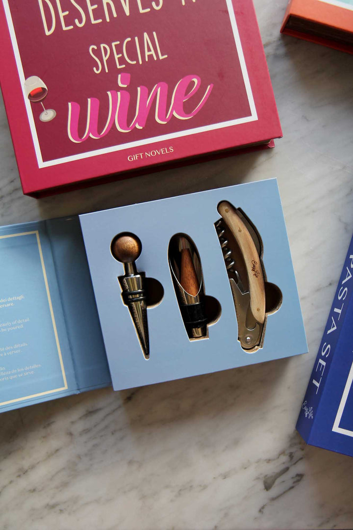 Wine accessories set in a box with 'Special Wine' text on a marble surface