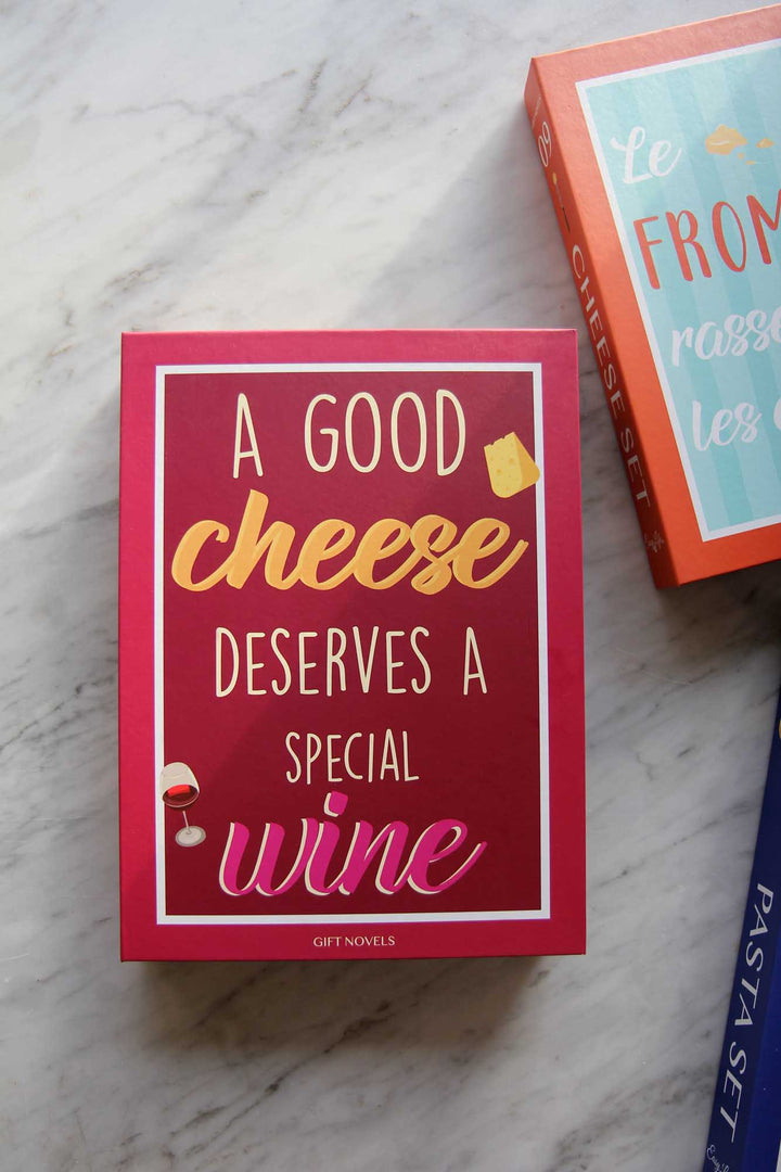Red card with 'A good cheese deserves a special wine' text on a marble surface