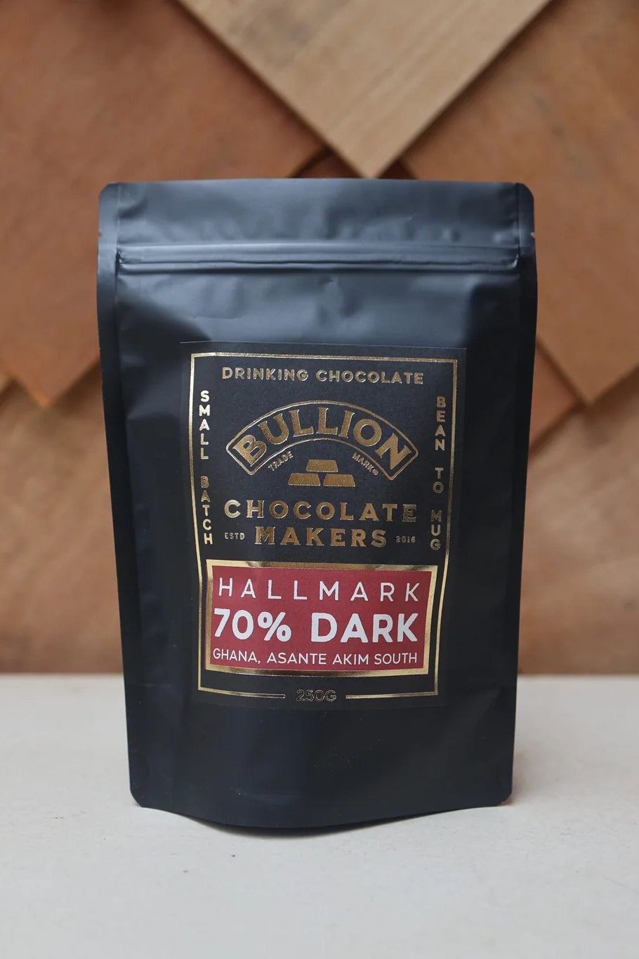 Bullion Chocolate Makers 70% Dark chocolate packaging on a wooden background