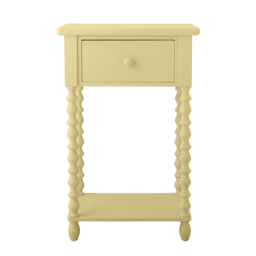 Yellow side table with a drawer on a white background