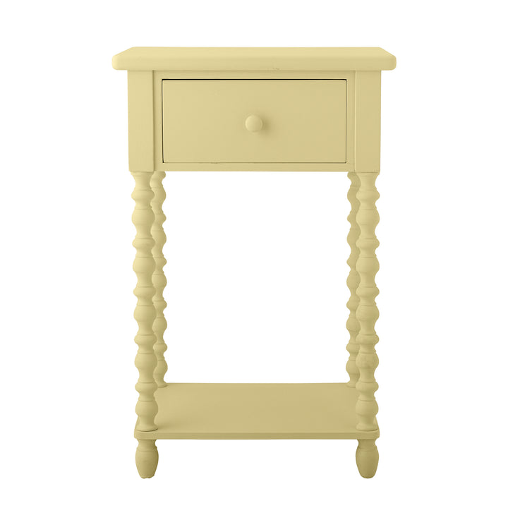 Yellow side table with a drawer on a white background