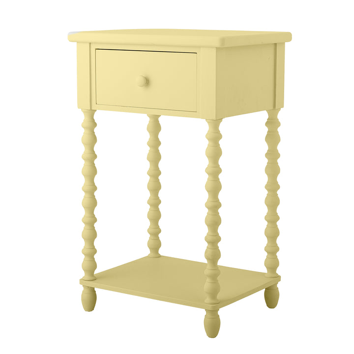 Yellow side table with a drawer and shelf on a white background