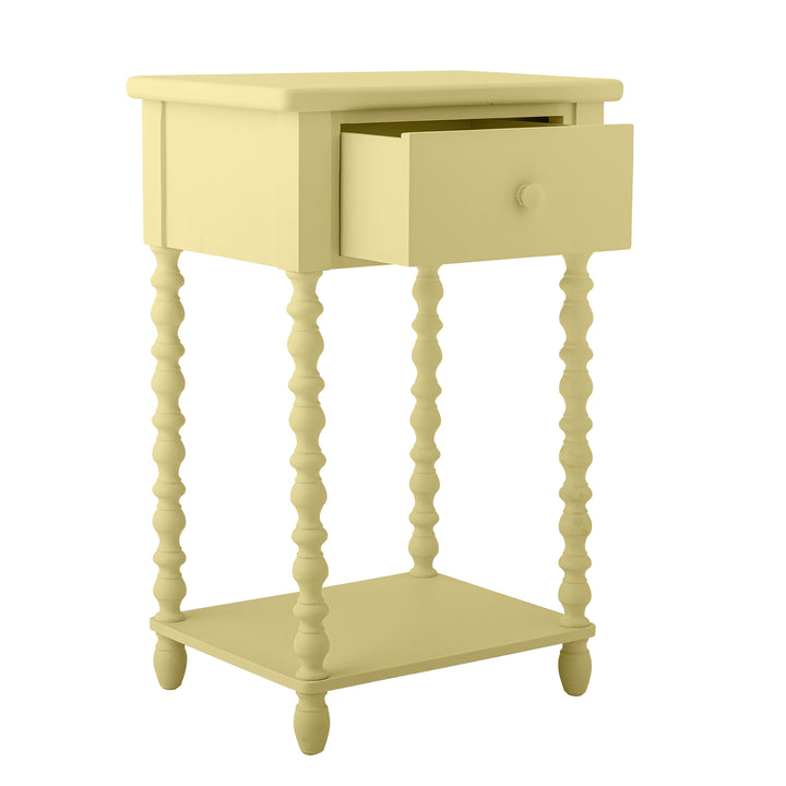 Light yellow side table with a drawer on a white background