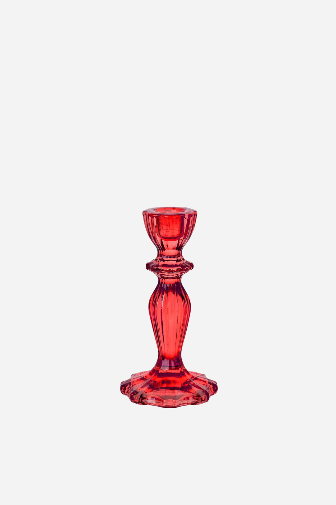 Red glass candle holder on a white background
